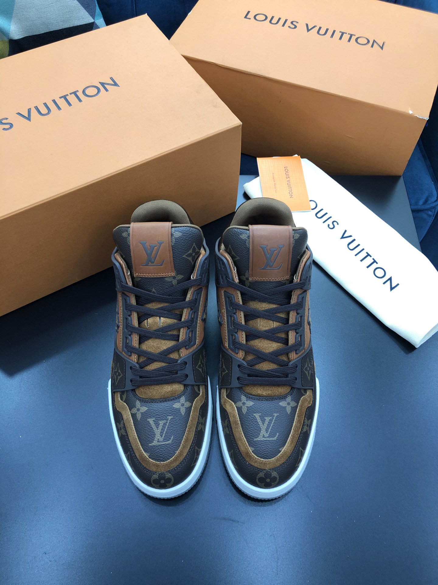 Louis Vuitton Trainer “ Yellow “ This version of the LV Trainer sneaker  combines Monogram leather with calfskin embossed with the Mini…